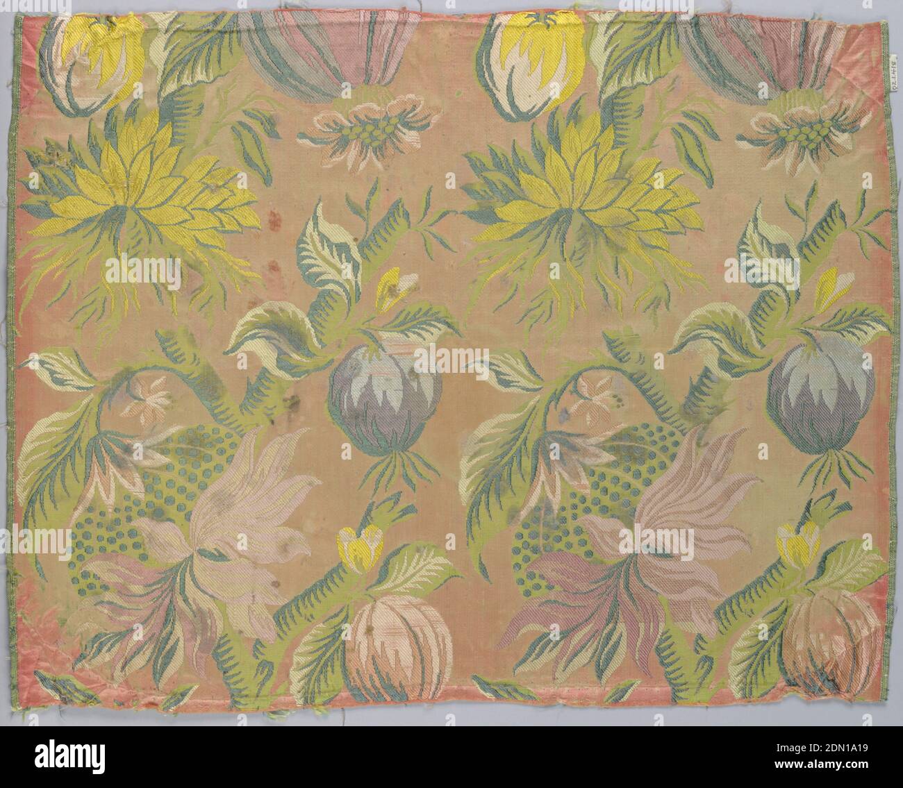 Textile, Medium: silk Technique: compound satin, brocaded, Pink satin ground with a diagonal arrangement of flowering branches and hanging fruit. In shades of pink, green, yellow, violet and blue. Selvage to selvage, Italy or Spain, ca. 1730, woven textiles, Textile Stock Photo