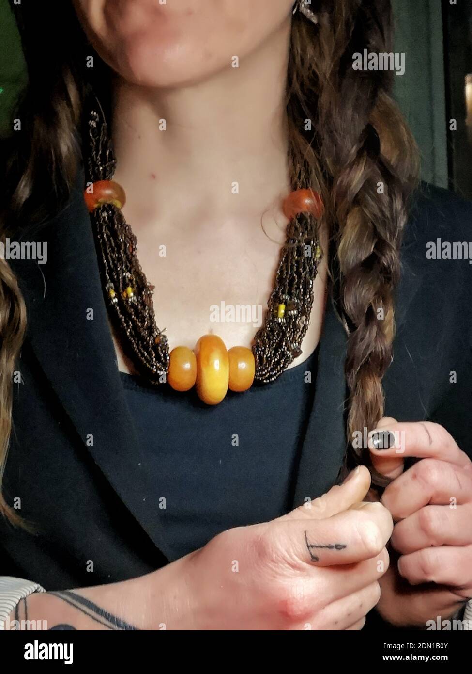 Close-up Of Woman With Amber Necklace Etsy Selling Stock Photo