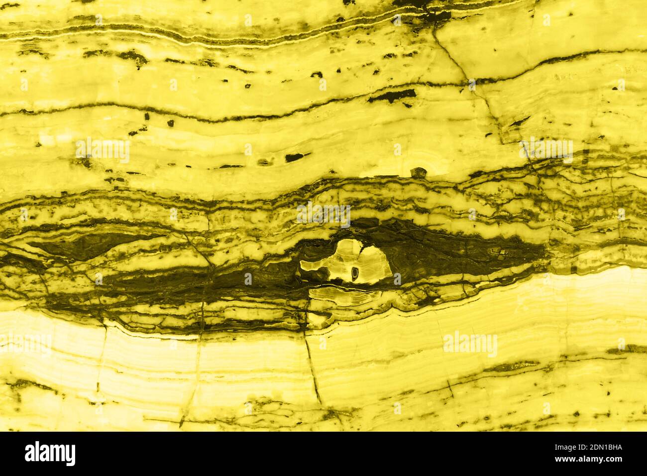 Natural marble texture toned in trendy yellow for background or backdrop. Color 2021 concept. Interior marble stone design. Stock Photo