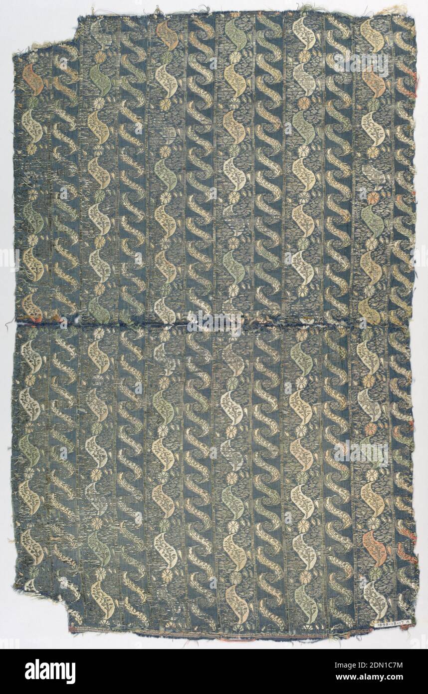 Fragment, Medium: silk, metallic thread Technique: woven, Stripes comprised of flower and leaf-like shapes on a dark blue background., India, 17th century, woven textiles, Fragment Stock Photo