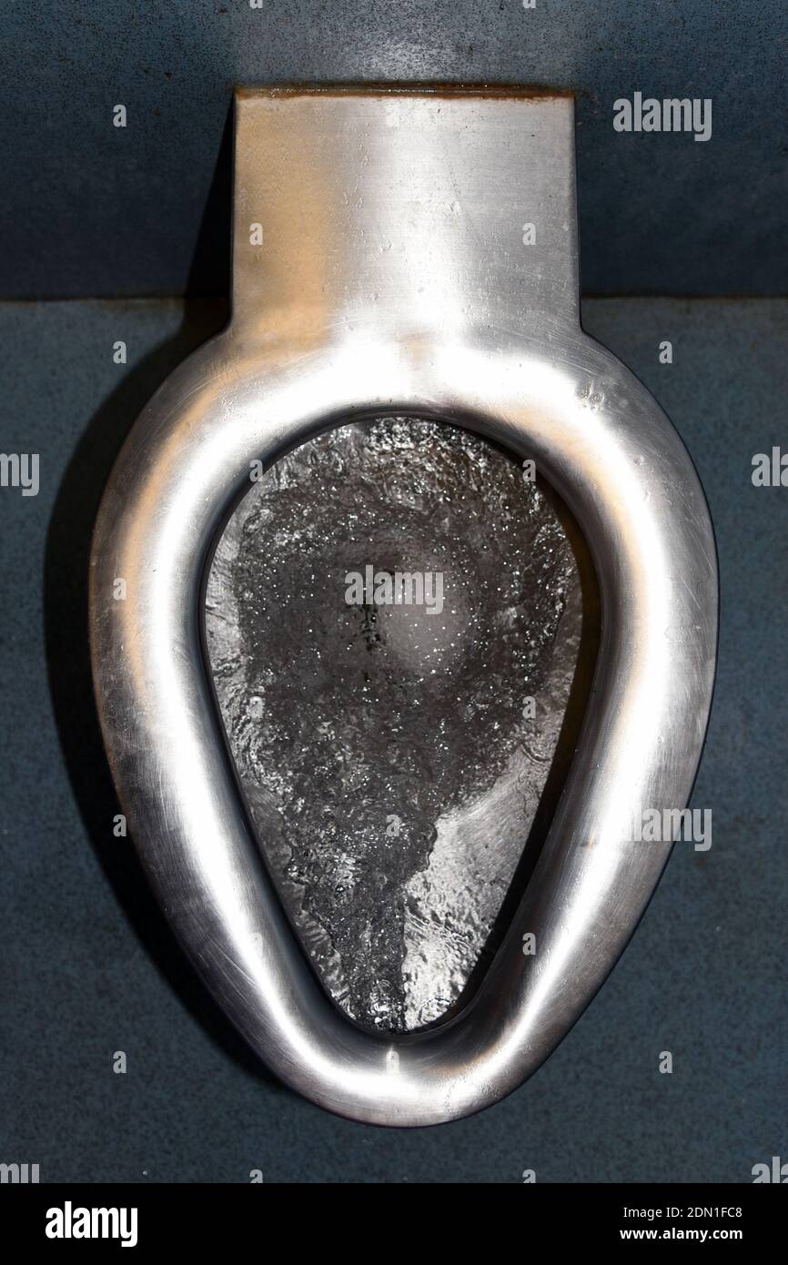Flushing toilet without seat from above Stock Photo Alamy