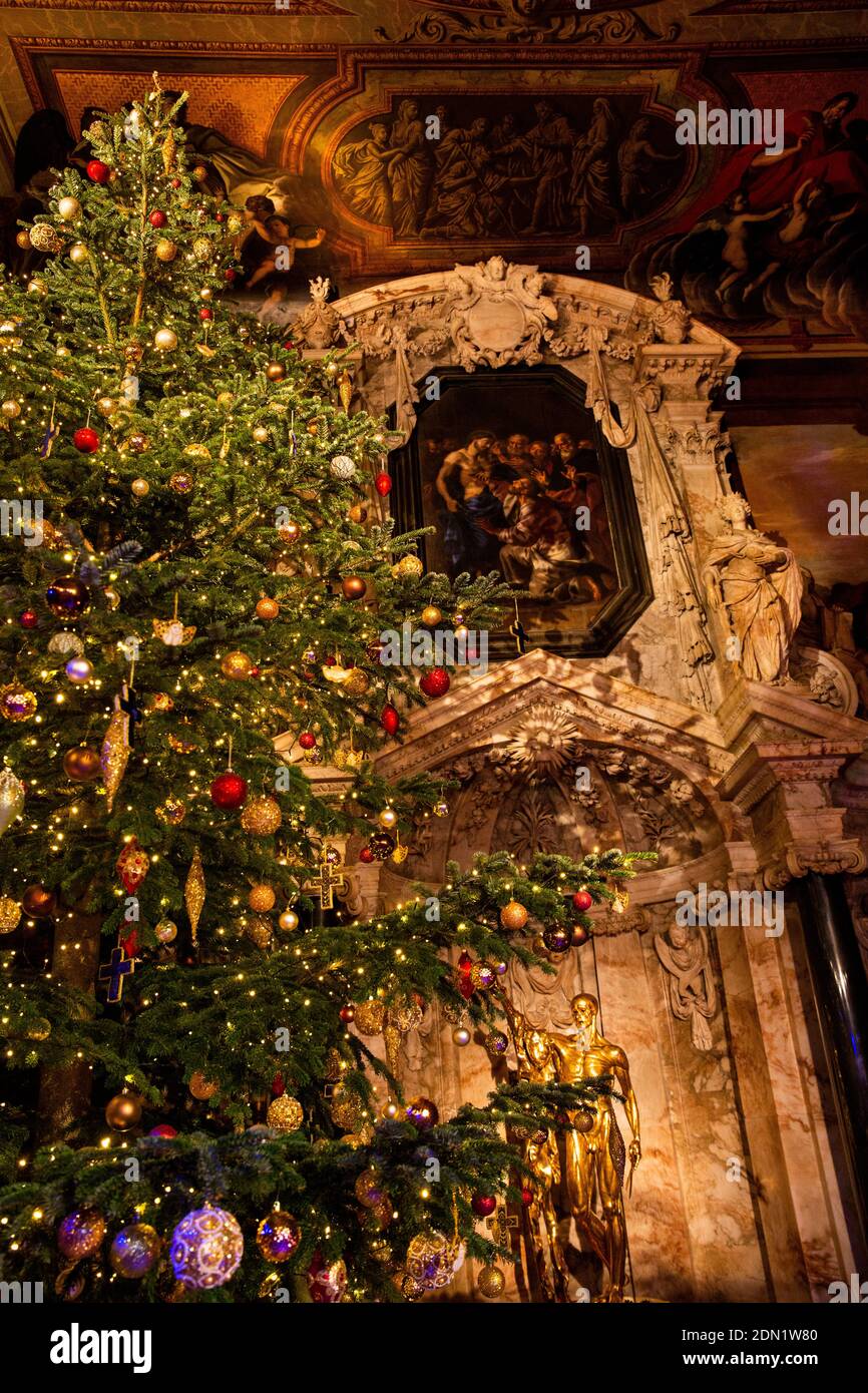 UK, England, Derbyshire, Edensor, Chatsworth House Chapel at Christmas, Lands Far Away, Spain, large Christmas tree beside Derbyshire Alabaster Altar Stock Photo