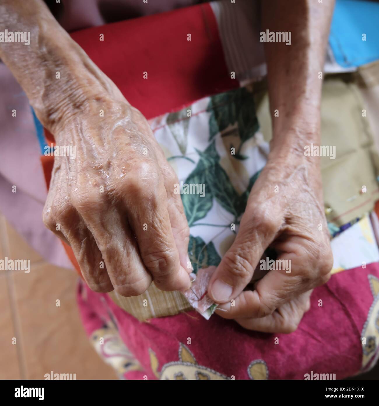 Person sewing southeast hires stock photography and images Alamy