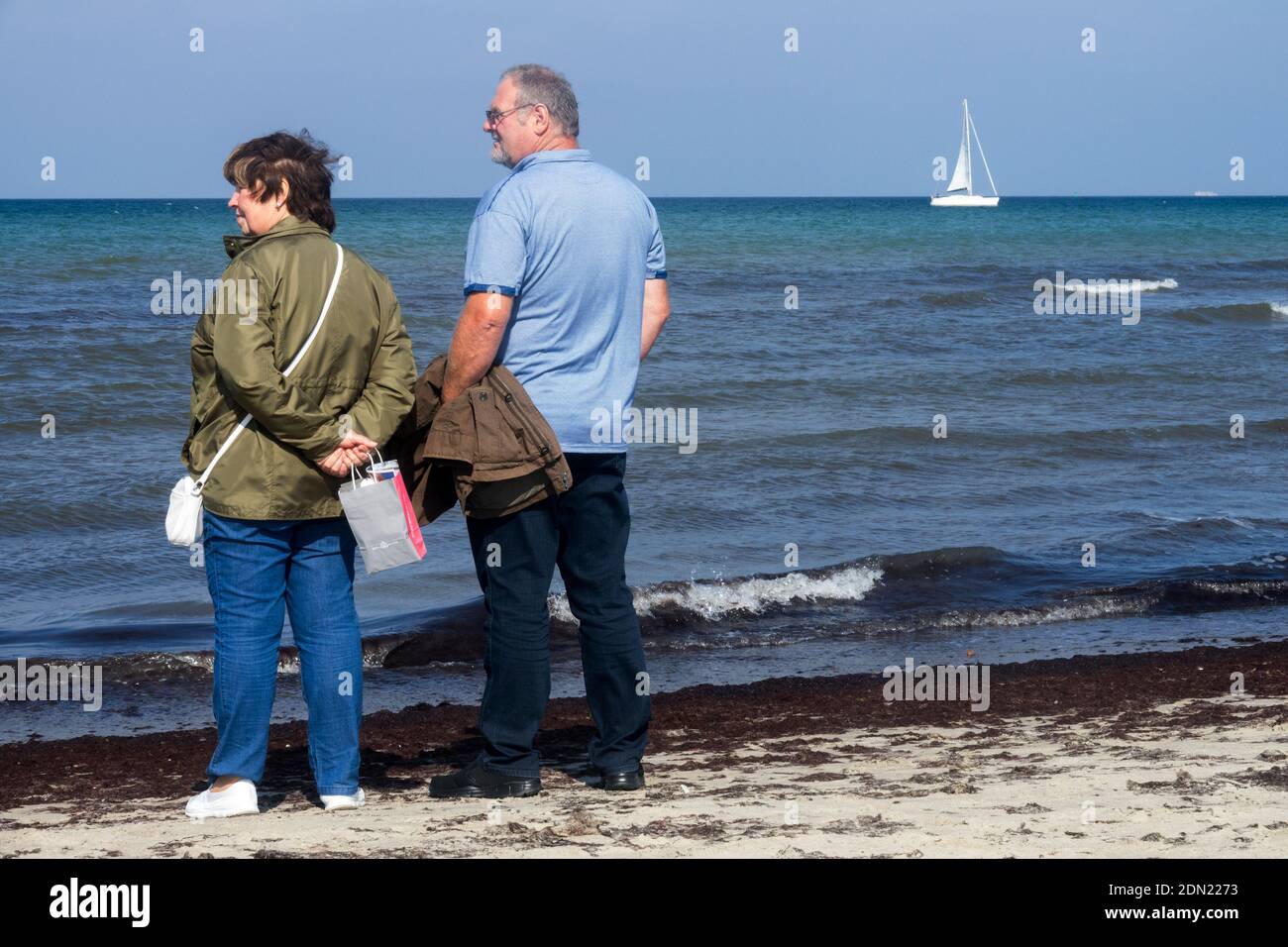 Senior couple on the beach, Baltic Sea shore Stock Photo