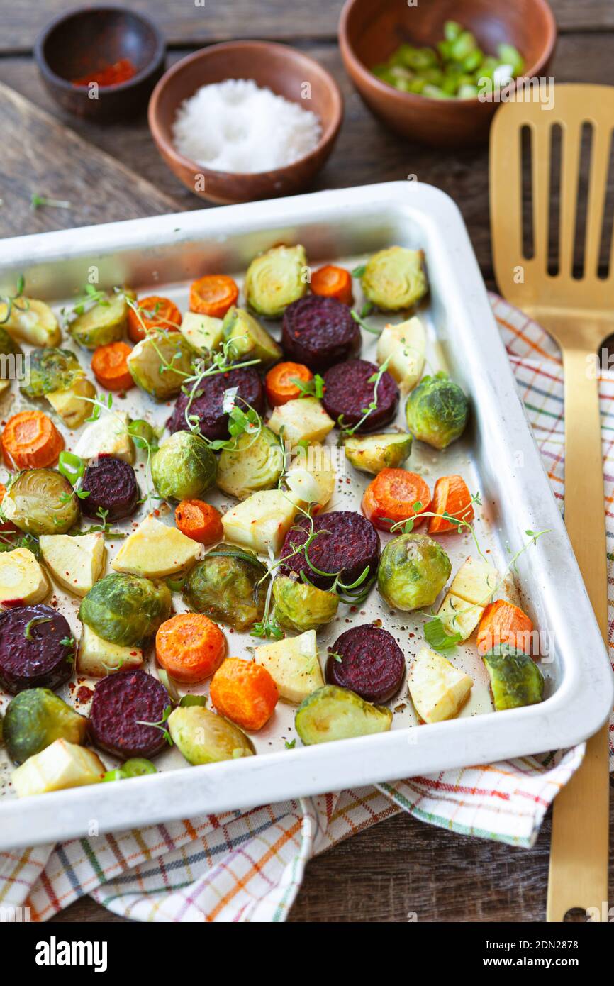Oven roasted winter vegetables with fresh herbs Stock Photo Alamy