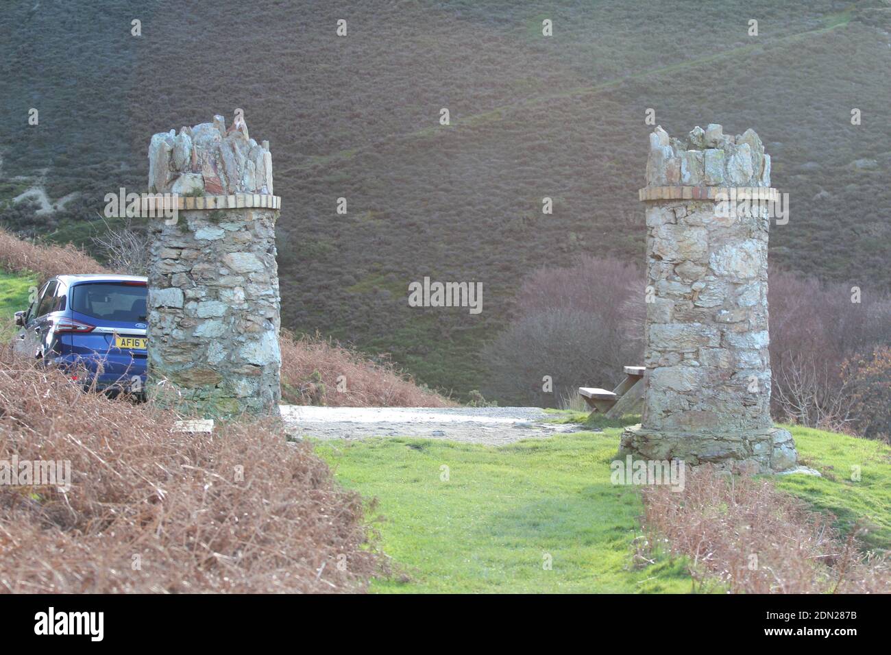 The stone pillars entrance to jubilee path on foel lus a coastal walk about about Penmaenmawr North Wales Stock Photo