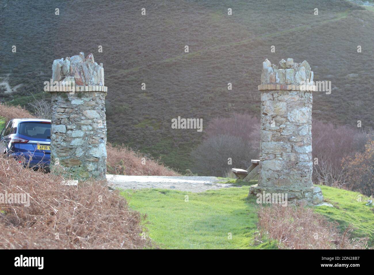 The stone pillars entrance to jubilee path on foel lus a coastal walk about about Penmaenmawr North Wales Stock Photo