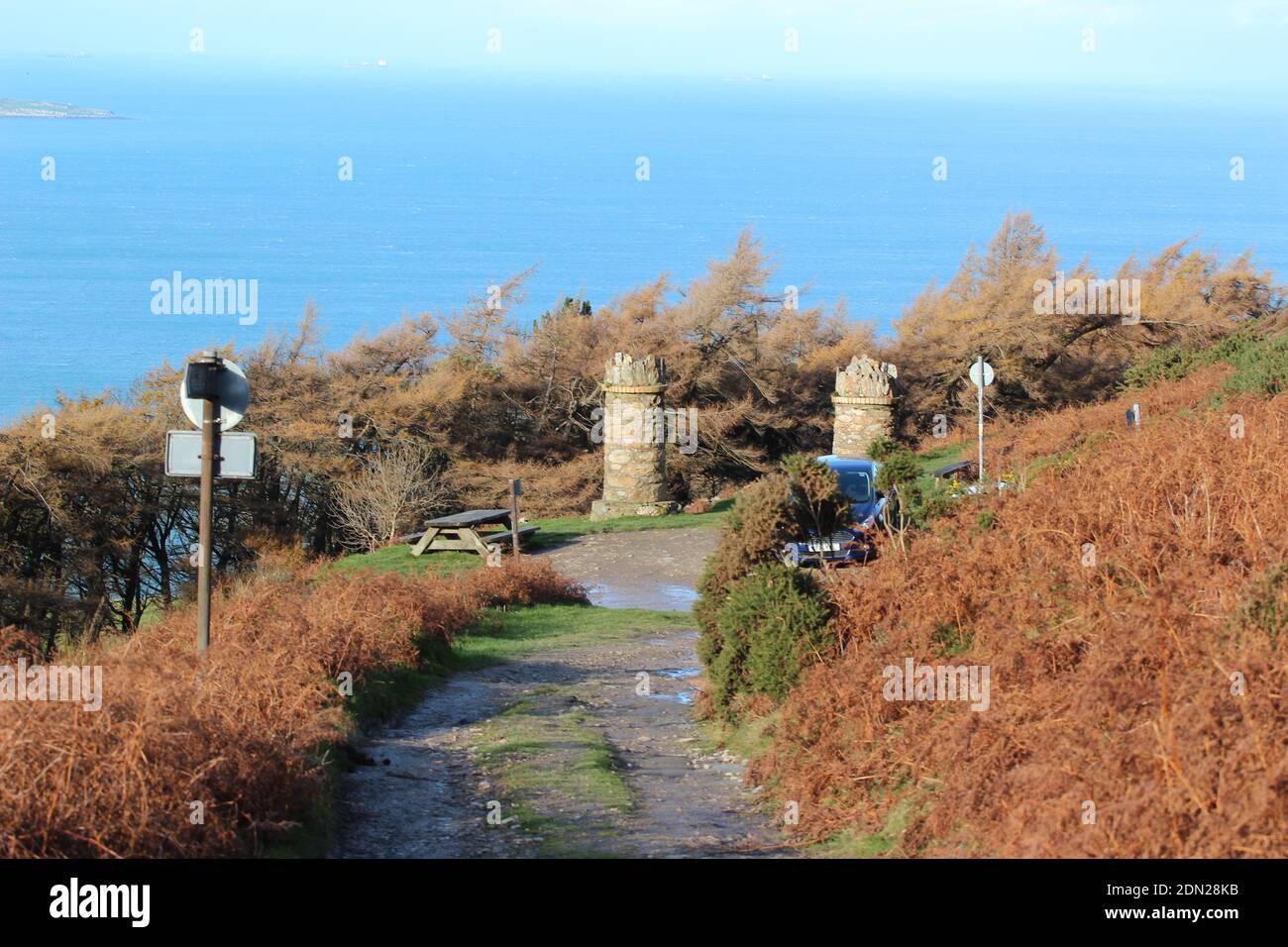 The stone pillars entrance to jubilee path on foel lus a coastal walk about about Penmaenmawr North Wales Stock Photo