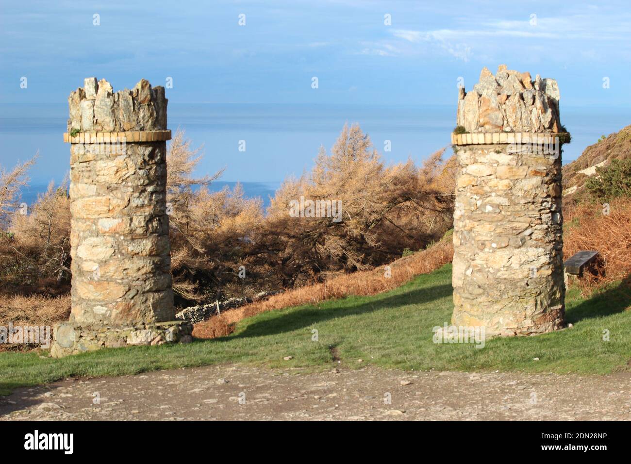 The stone pillars entrance to jubilee path on foel lus a coastal walk about about Penmaenmawr North Wales Stock Photo