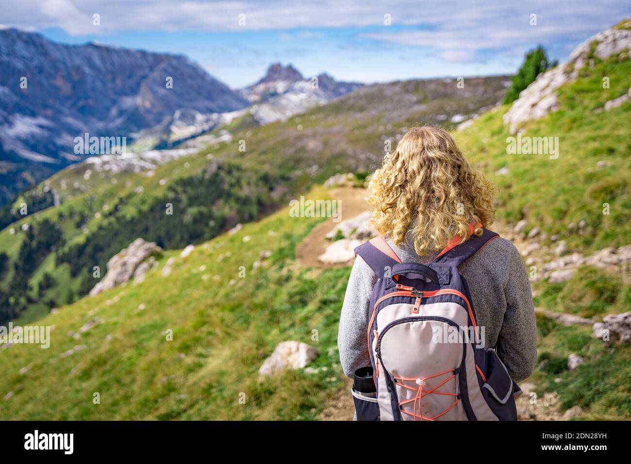 female hiker hiking in the alps Stock Photo - Alamy