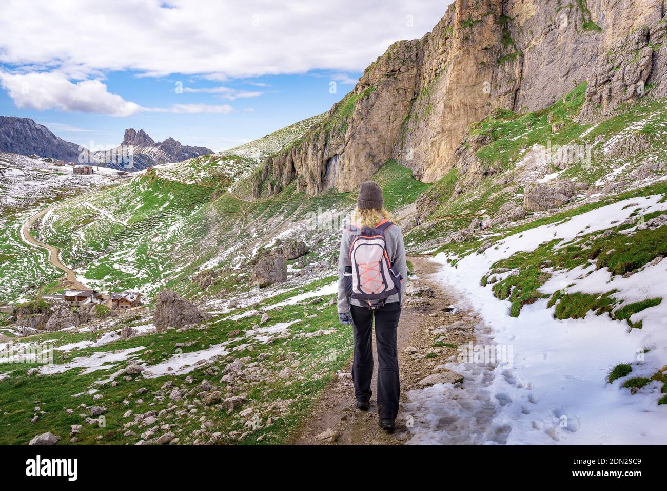 female hiker walking in the austrian dolomites on trekking trail Stock ...