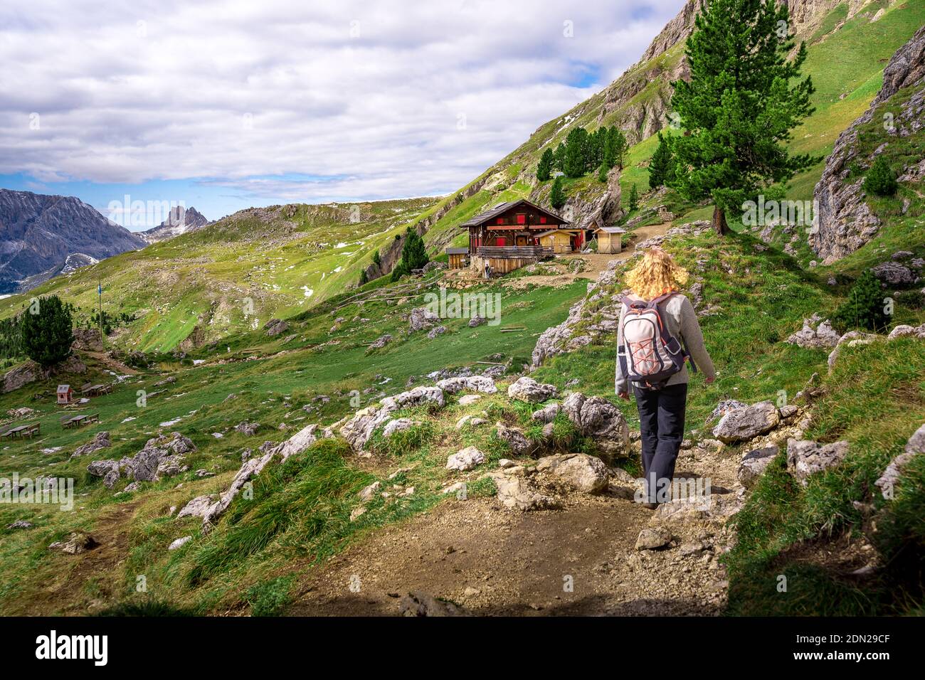 woman hiking to wooden house in the austrian alps Stock Photo - Alamy
