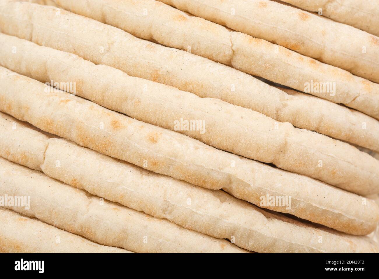 Pitta breads neatly stacked ready for reheating and use in serve