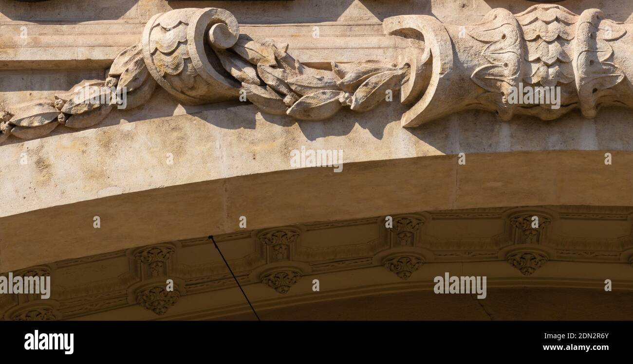 Elements of architectural decorations of buildings, gypsum stucco, plaster ornaments and patterns, wall texture. On the streets in Spain, public place Stock Photo