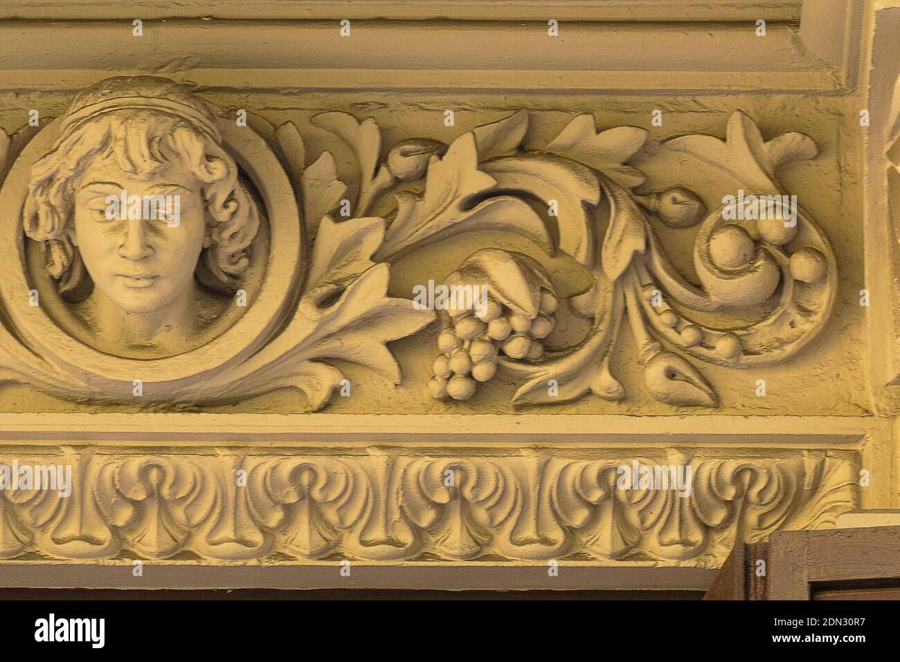 Elements of architectural decoration of buildings, stucco patterns with  flowers and faces, gypsum ornaments and wall textures Stock Photo - Alamy