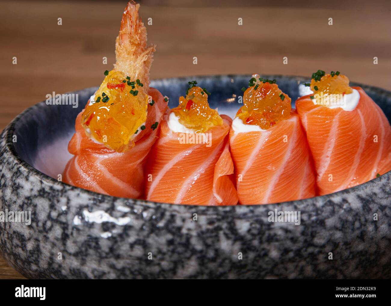 Delicious battered prawn nigiri wrapped with salmon. Traditional
