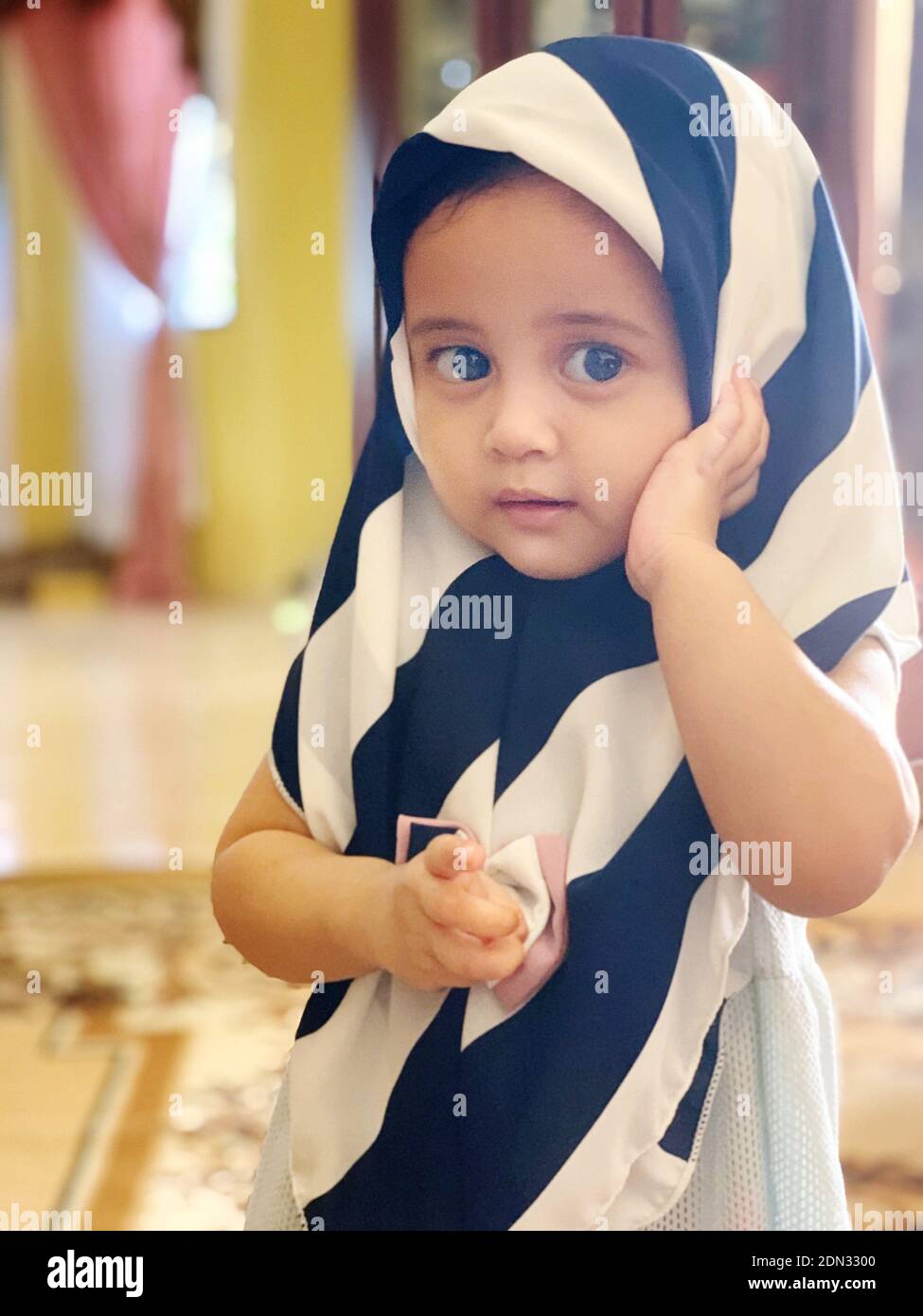 Portrait Of Cute Baby Girl Wearing Hijab Stock Photo - Alamy