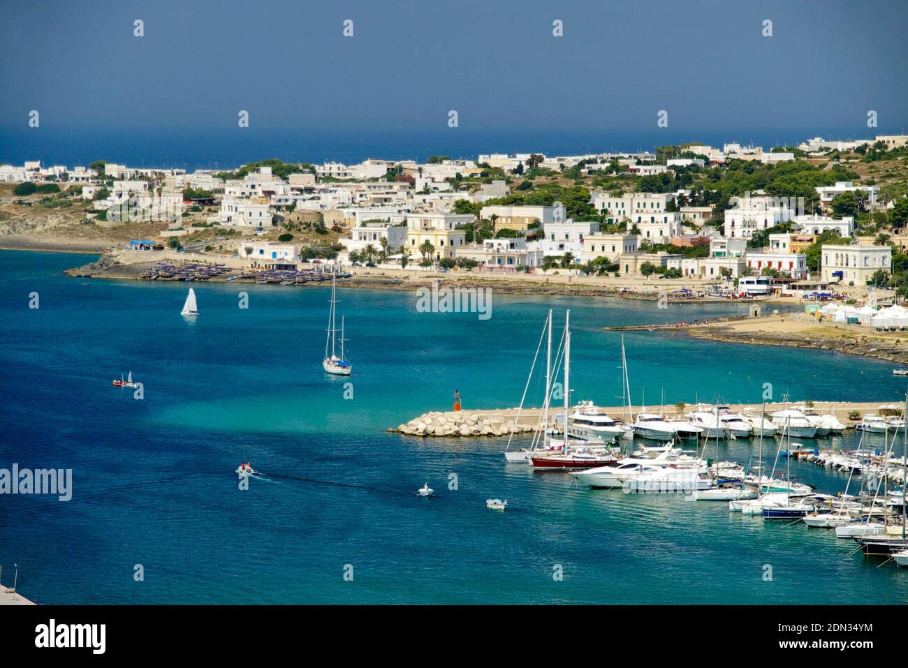 Sailboats In Sea Against Buildings In City Stock Photo