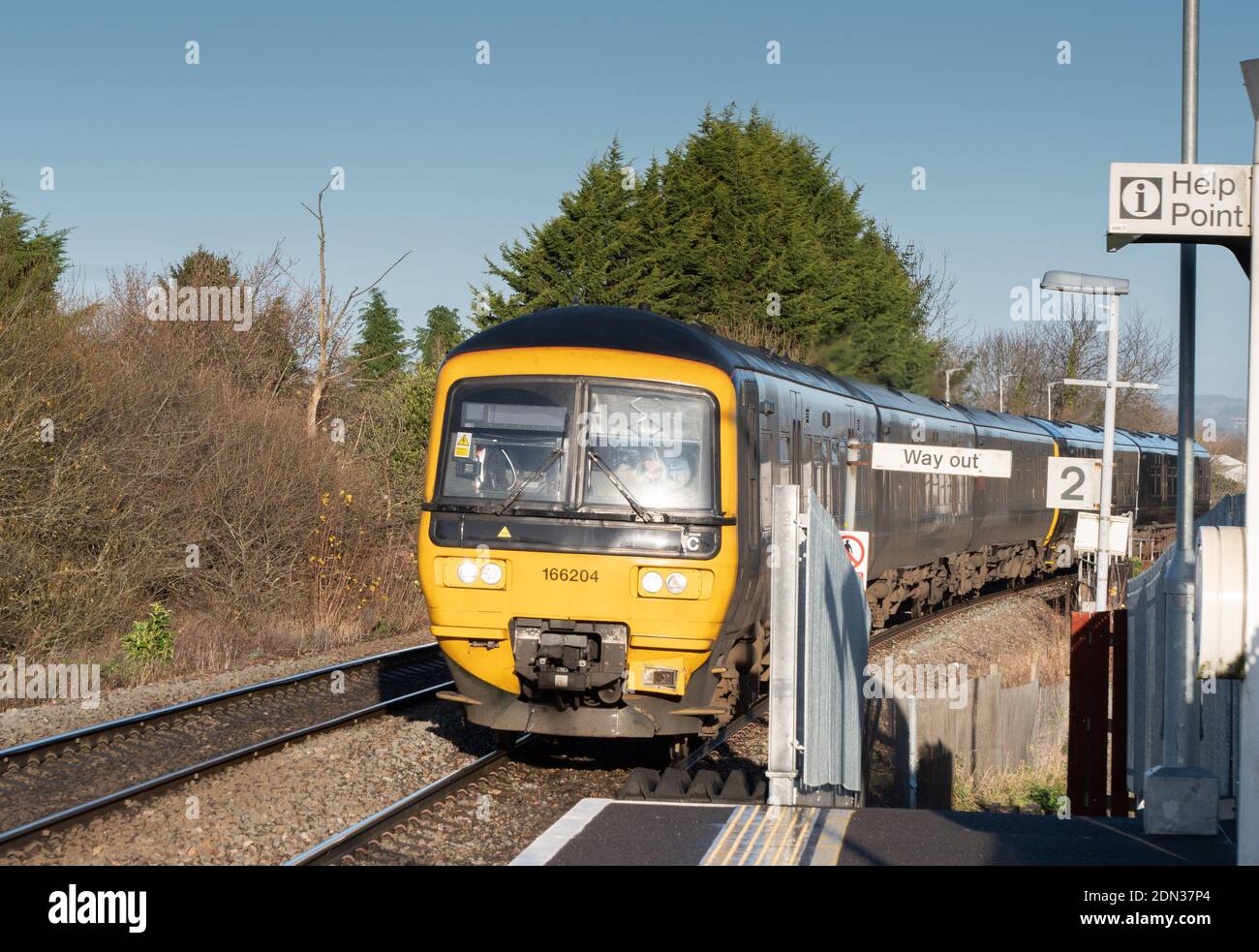 A 5 car DMU on tracks approaching Dilton Marsh Halt, near Westbury, Wiltshire, England, UK. Stock Photo