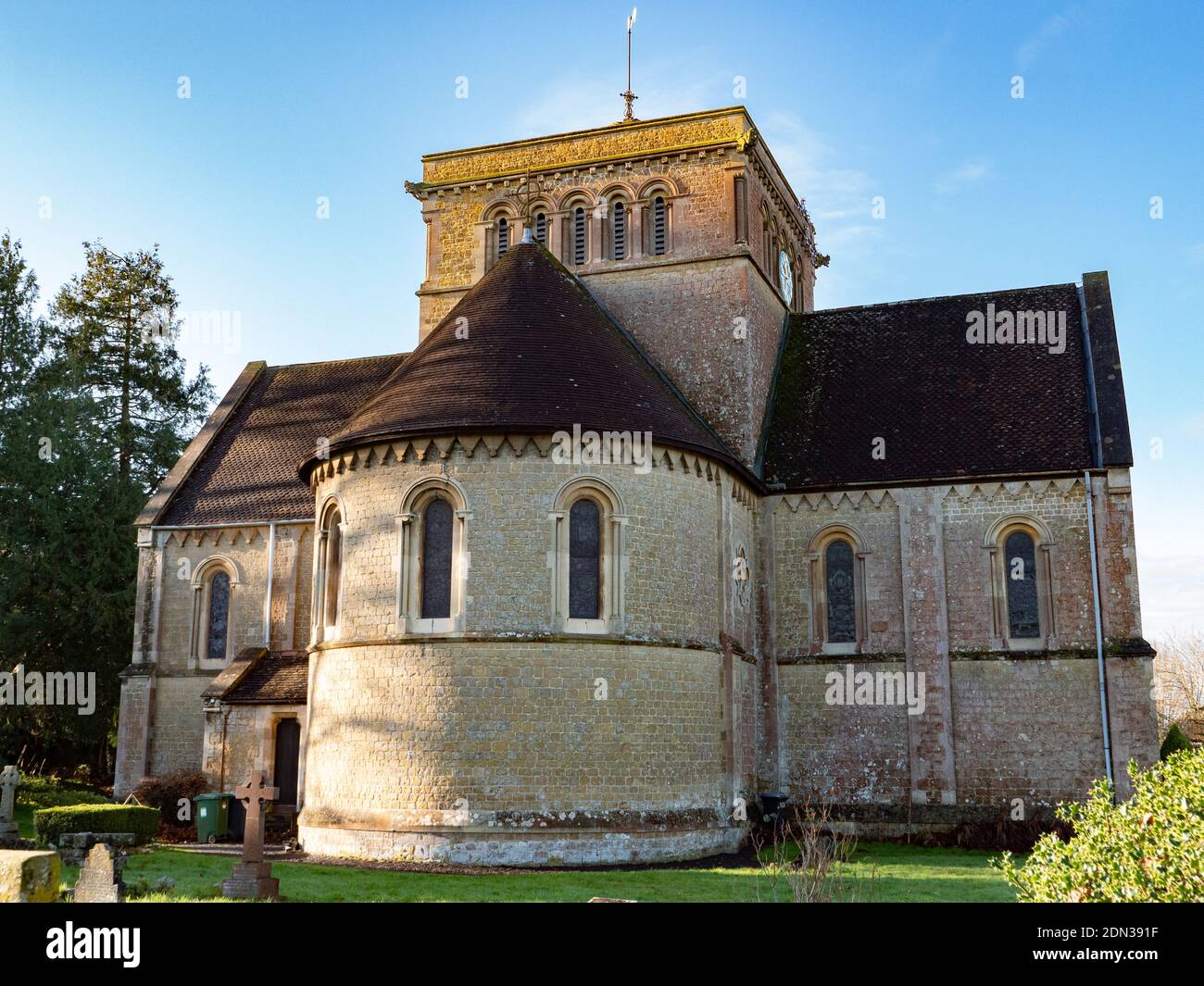 The 19th century Holy Trinity Church at Dilton Marsh, Wiltshire, England from the churchyard and showing the transepts, apse and bell tower. Stock Photo