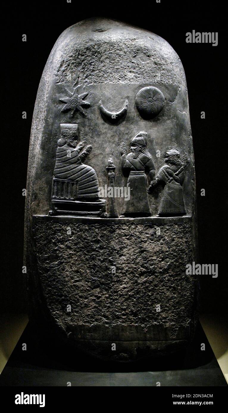 Kudurru (stele) of King Melishipak (1186-1172 BC). The king presents his daughter to the goddess Nannaya. The crescent moon represents the god Sin, the sun the Shamash and the star the goddess Ishtar. Kassite period. Taken to Susa (Iran) in 12th century BC by Elamite king Sutruk-Nahhunte as war booty. Limestone. Louvre Museum. Paris, France. Stock Photo