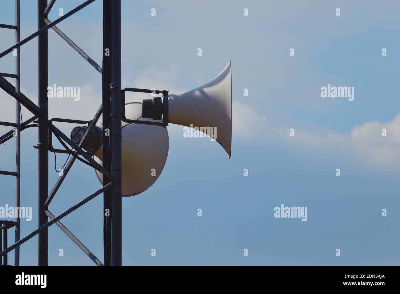 Low Angle View Of Speakers On Pole Against Sky Stock Photo