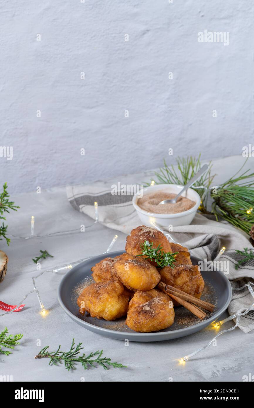 Traditional portuguese Christmas sweets Sonhos with sugar and cinnamon