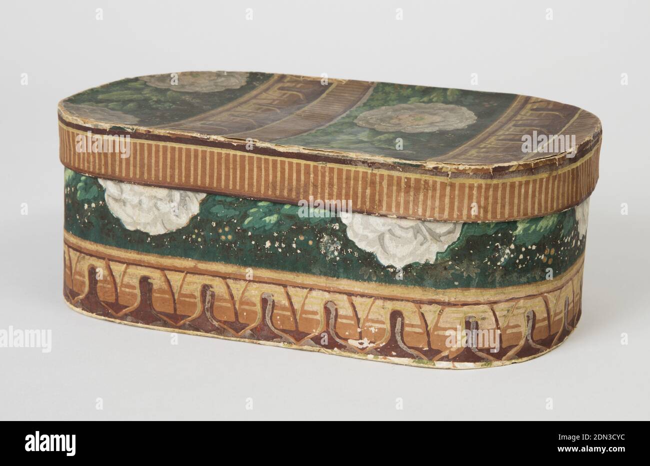 Bandbox, John Perkins, Block-printed paper, pasteboard support, Small pasteboard bandbox covered with wallpaper border pattern, pieced so one horizontal border band encircles bottom and a narrow edging strip covers rim of lid. Stylized architectural leaf band in browns and yellows, and band of stripings. Principal banding: on dark green background, green leaves and white camellias with pink and yellow centers, in continuous band. Strip of unfaded color under lid. Remnants of a different floral sidewall paper with a yellow ground around edge on box bottom., New Bedford, Massachusetts, USA Stock Photo