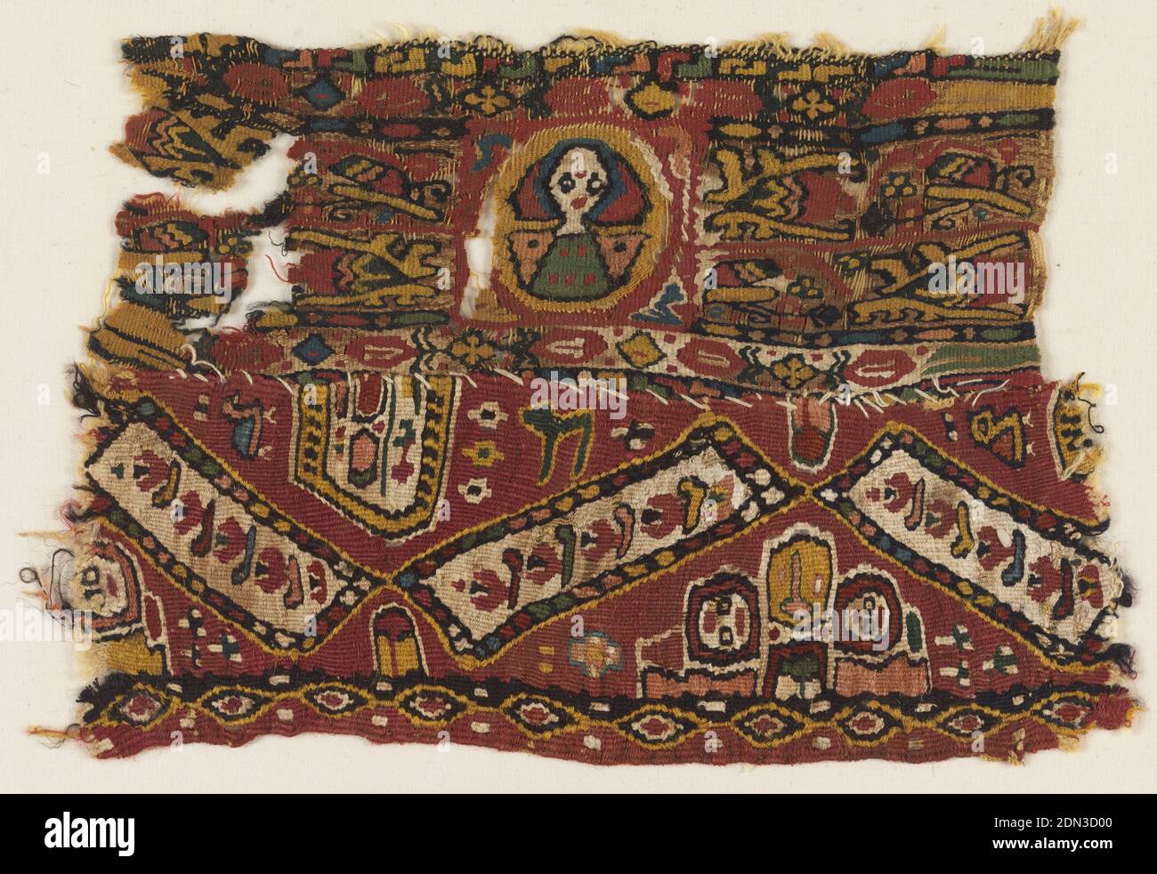 Textile, Medium: linen, wool Technique: tapestry weave, Two pieces sewn together. Tapestry weave linen and wool textile with design of a figure within a roundel surrounded by yellow patterns on a red ground. At bottom, three interconnected rectangles aurrounded by birds, flowers and heads. Three bands of horizontal geometric ornament: at top, interlocking L-shapes; at center, flowers, lozenges and diamonds; at bottom, interconnected eye forms with dots., Egypt, 700–1000, woven textiles, Textile Stock Photo