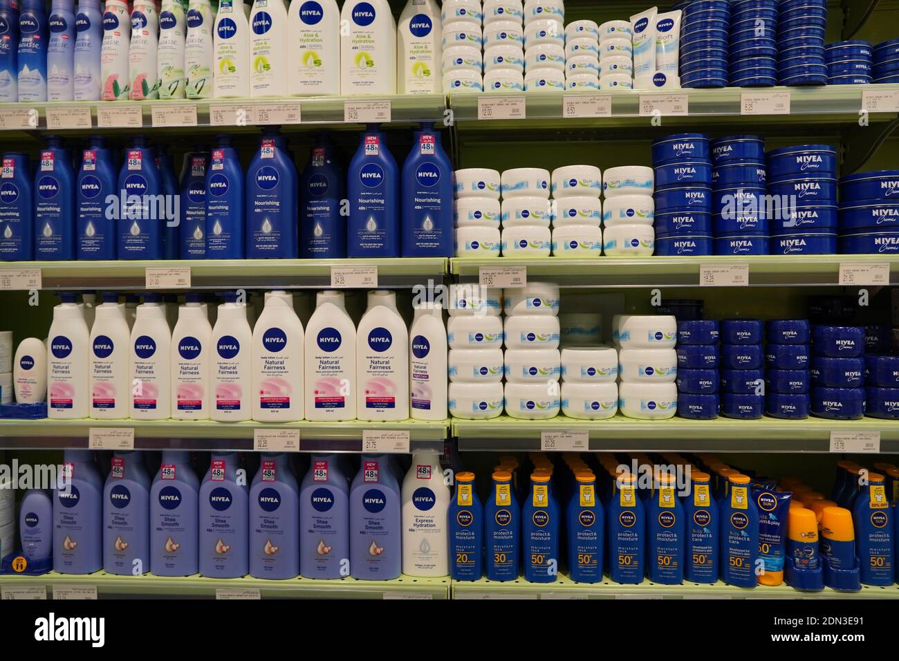 Nivea Serum, Fairness Lotion, Lip Gloss, Sun Block, Sunscreen, Sun Spray. Bottles And Jars. Nivea Skincare And Cosmetic Products For Sell On Supermark Stock Photo