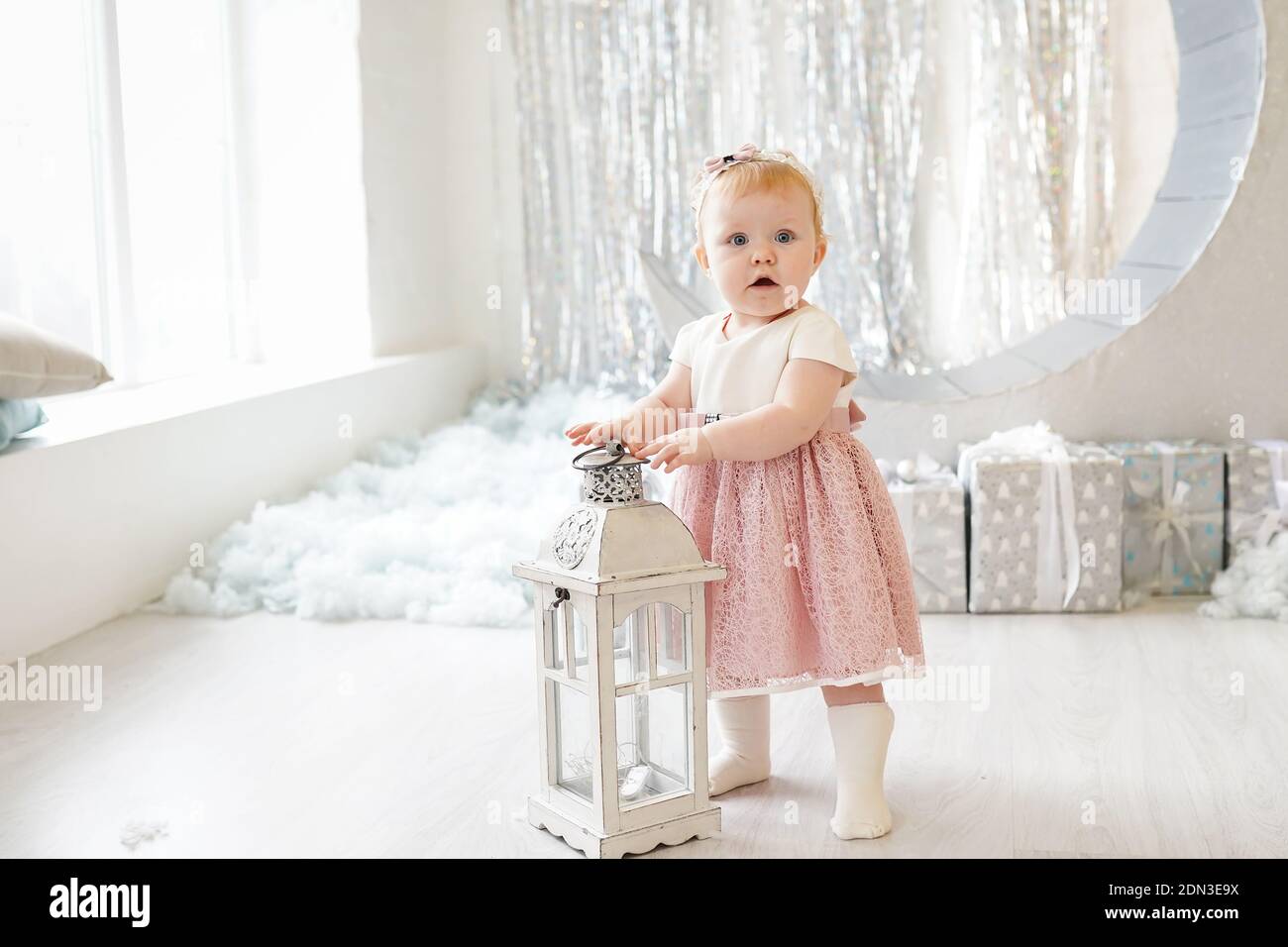 Pretty little girl in cute dress with pink bow looking like a little ...