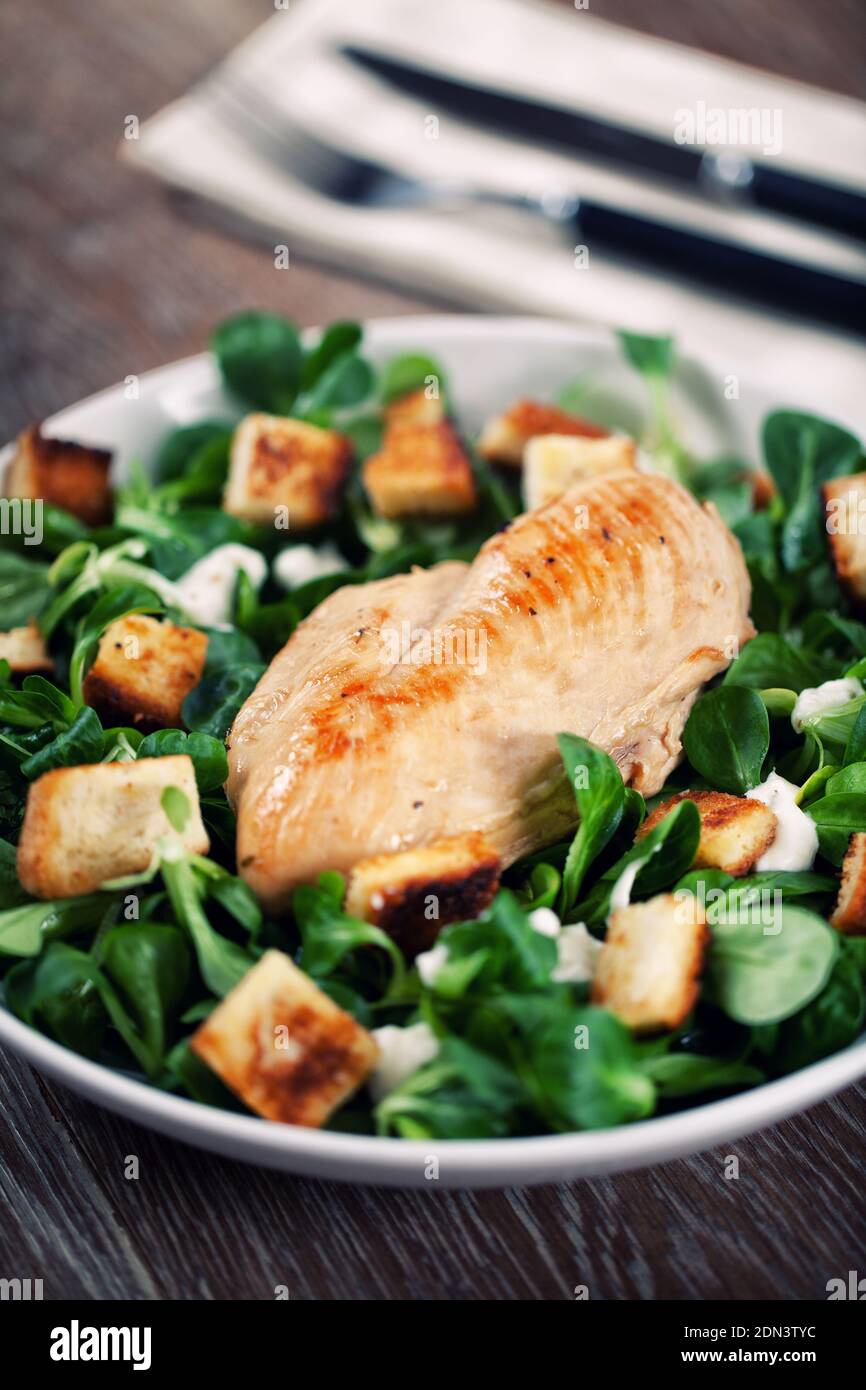 Delicious caesar salad with homemade croutons and dressing Stock Photo