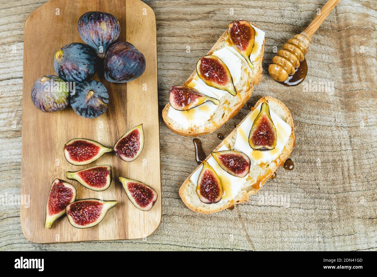 Figs with fresh cheese on toast Copy space. Stock Photo