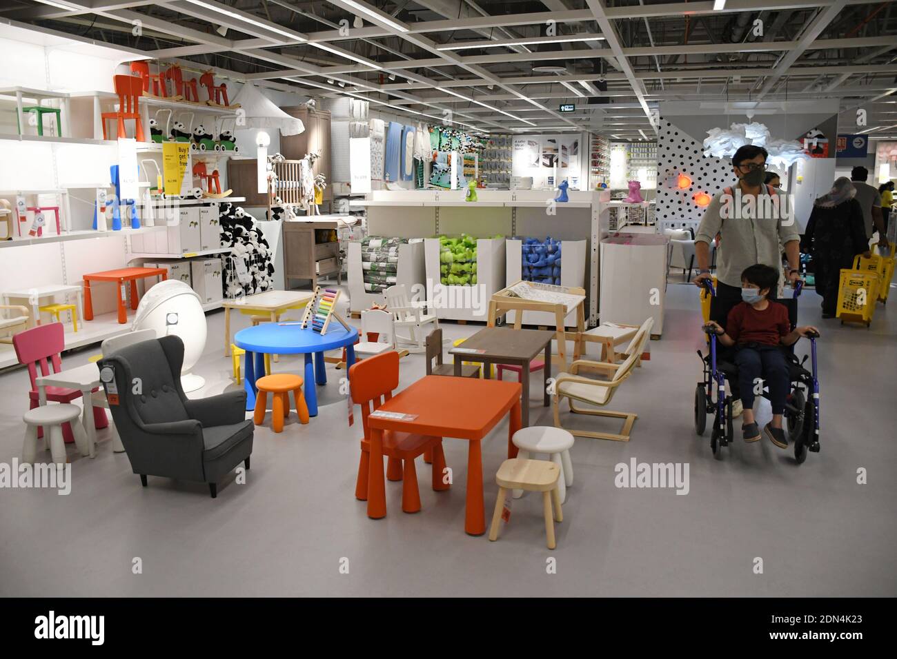 Mumbai, India. 17th Dec, 2020. A man pushing a baby stroller seen shopping  inside the store during the launch.IKEA, a Swedish multinational store  selling home decor products launched its second store in