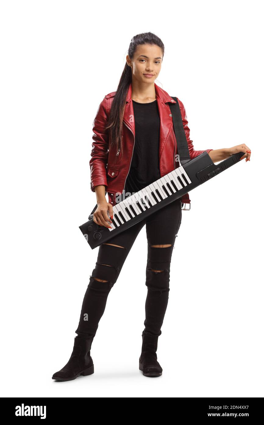 Young female in a leather jacket with a keytar music instrument isolated on white background Stock Photo