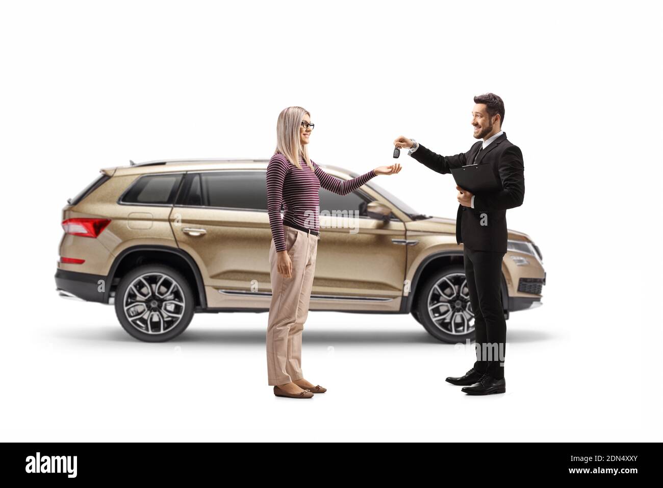 Salesman giving SUV car keys to a blond woman isolated on white background Stock Photo
