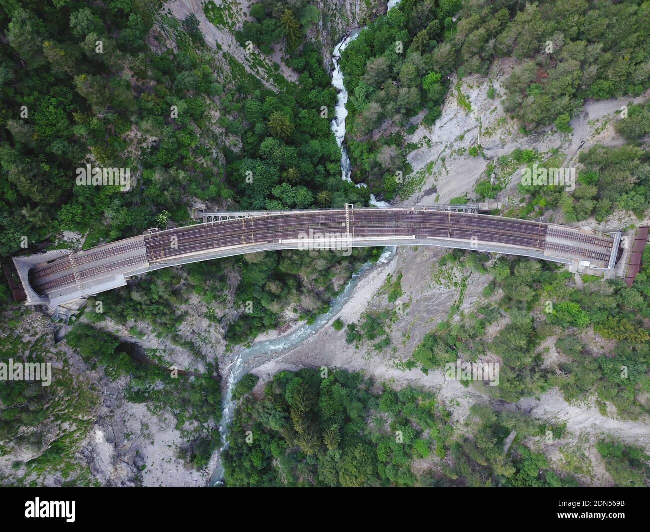 High Angle View Of Bridge Over Road Amidst Trees Stock Photo