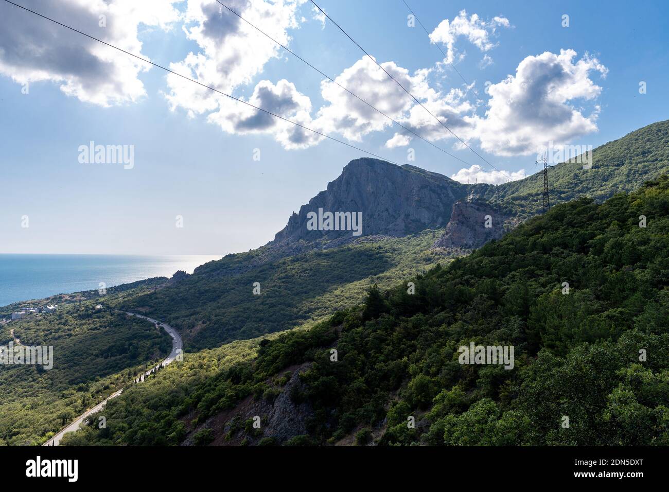 Scenic View Of Sea And Mountains Against Sky Stock Photo