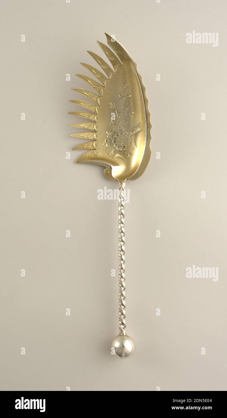 Macaroni server, Gilt silver, Wide concave blade with feather-like serated edge and engraved floral ornament; handle in form of twisted stem with ball finial., USA, ca. 1865, cutlery, Decorative Arts, Macaroni server Stock Photo