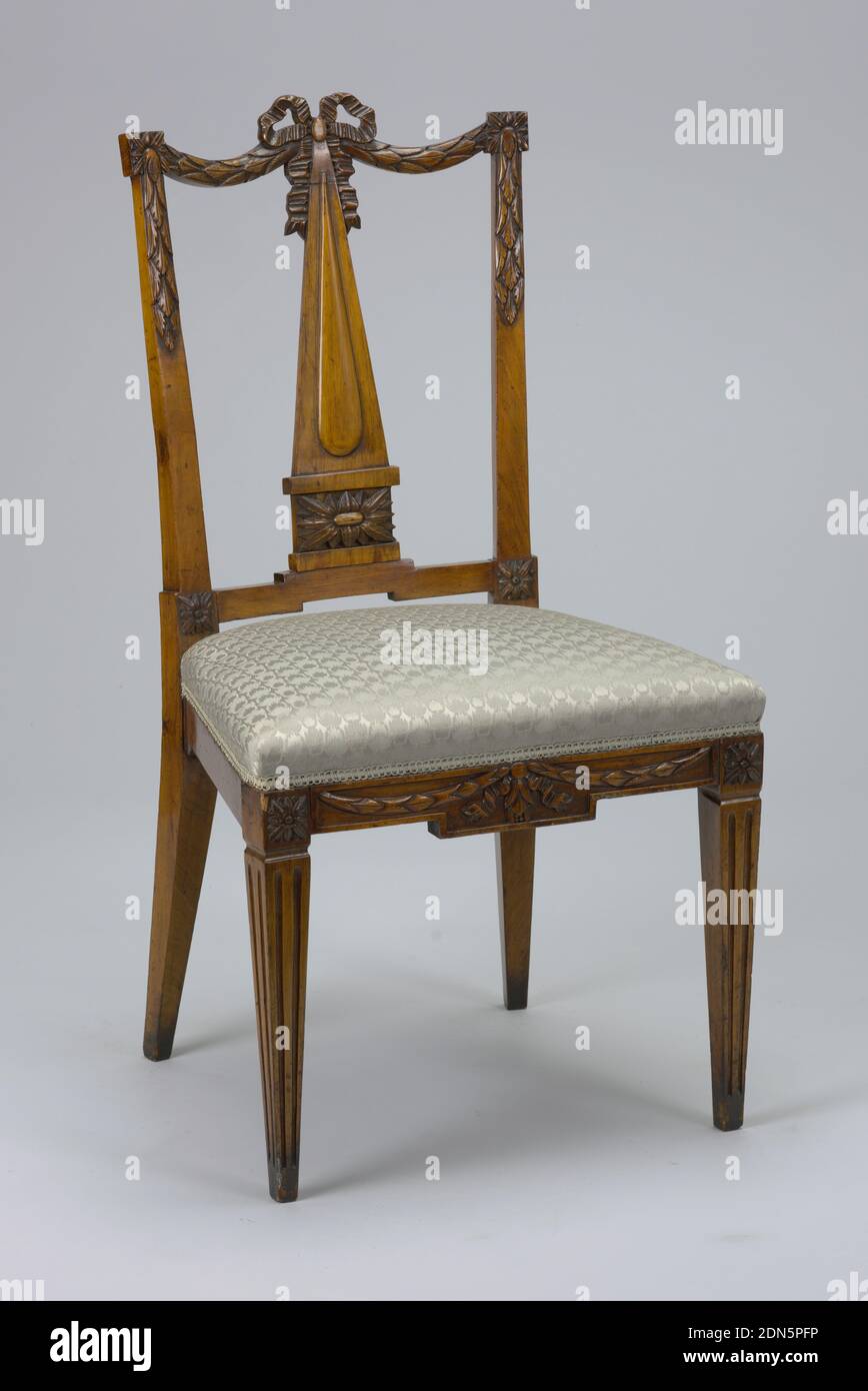 Chair, Fruit wood and elm, Rectangular open back; top rail composed of two swags centering a bowknot. Posts are carved with pendant garlands. The splat is an obelisk-form surmounting a square rosette. Front role of upholstered seat is carved with ribbons and pendant swags. Front legs are square, tapered and fluted; rosettes at knees., Netherlands, late 18th century, furniture, Decorative Arts, Chair Stock Photo