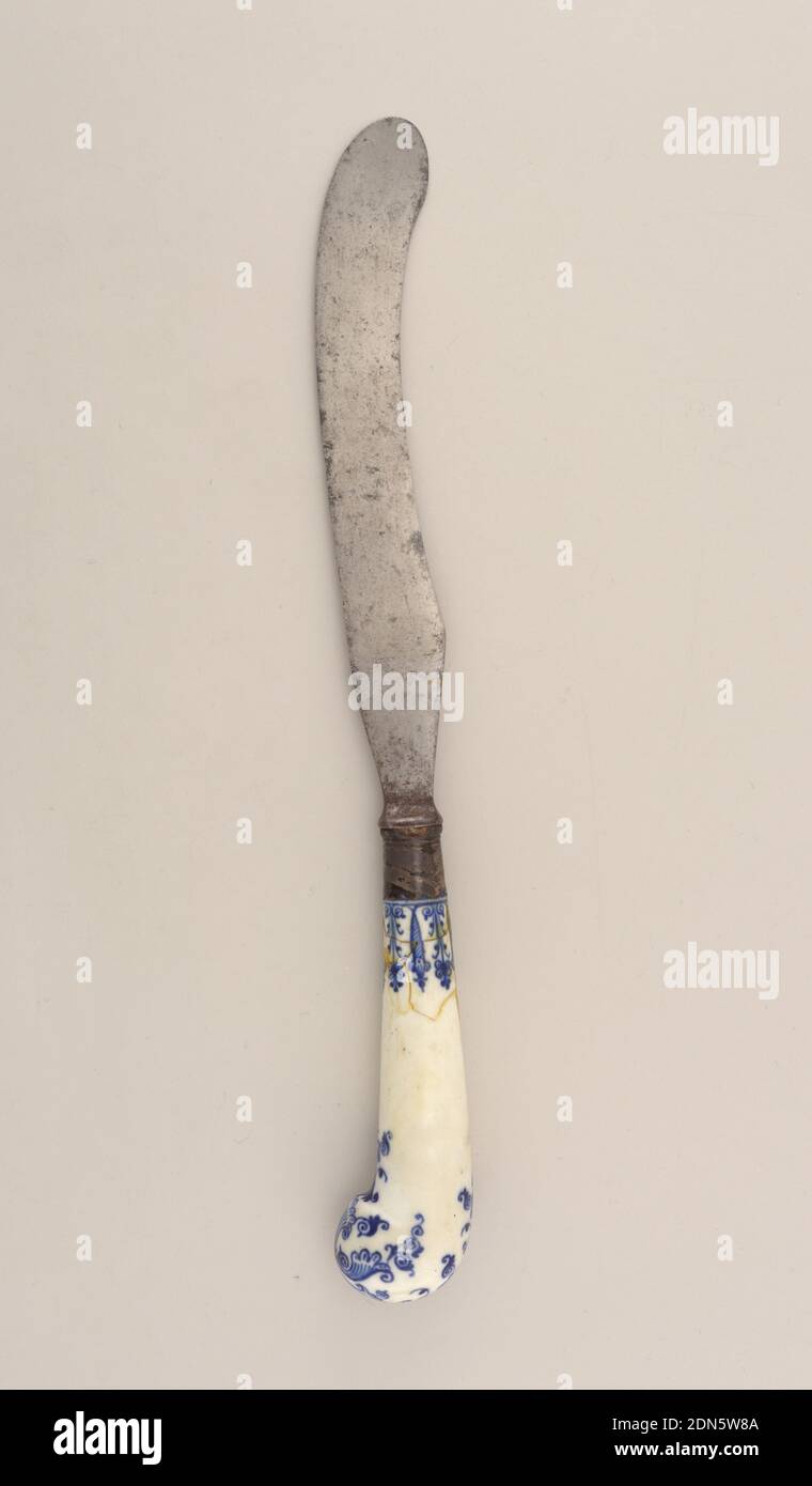 Knife with Blue Pattern, Saint-Cloud Porcelain Manufactory, French, active by 1693 - 1766, steel, silver, porcelain, vitreous enamel, Sabre-shaped blade, plain bolster. Banded silver ferrule with scalloped edge. Pistol-shaped white porcelain handle with dark blue floral and scrolled decoration., France, ca. 1744, cutlery, Decorative Arts, knife, knife Stock Photo