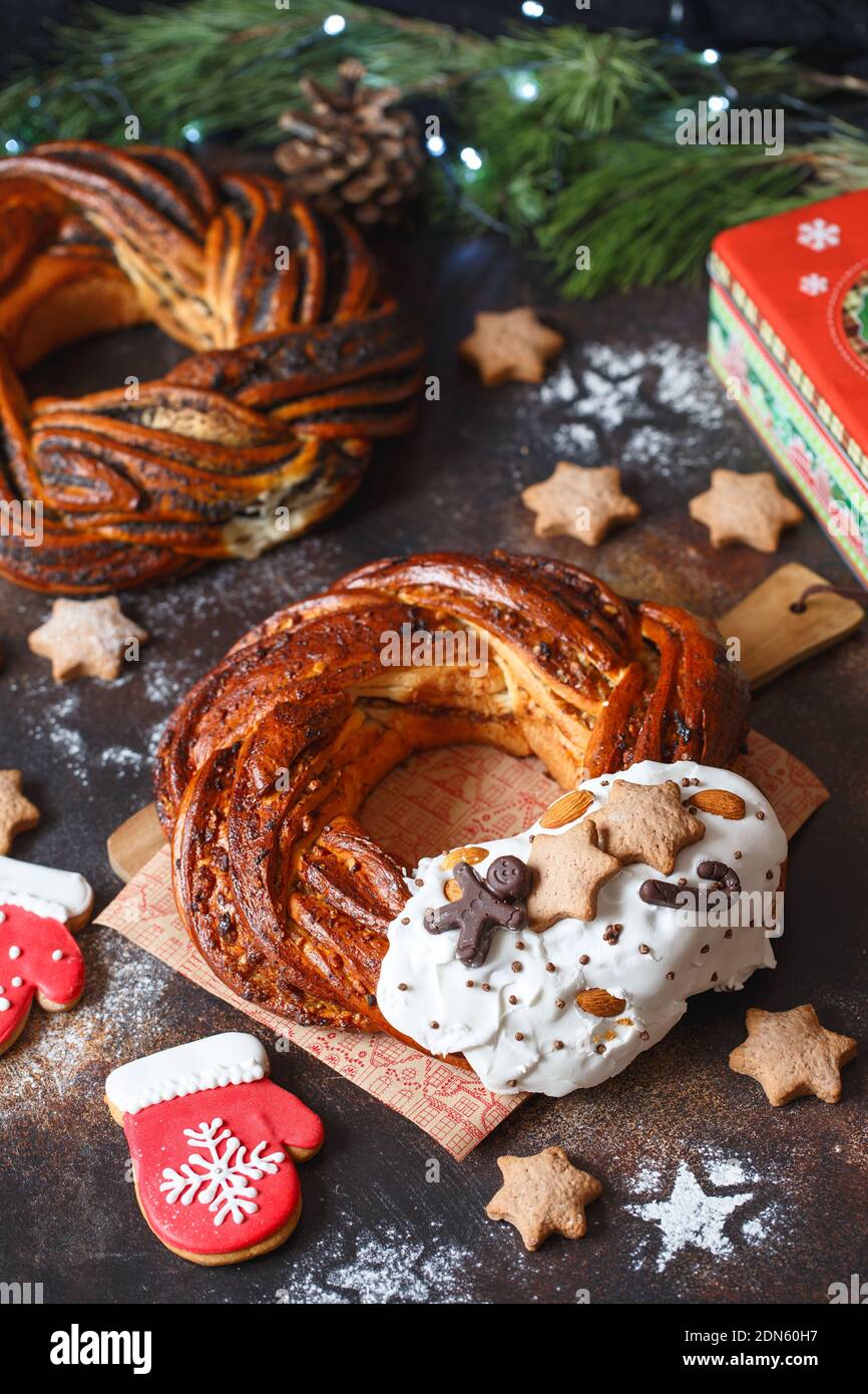 Sweet Bread Wreath decorated with stars cookies. Honey brioche garland with chocolate and nuts. Holiday recipes. Braided Bread. Cinnamon Twist Bread W Stock Photo