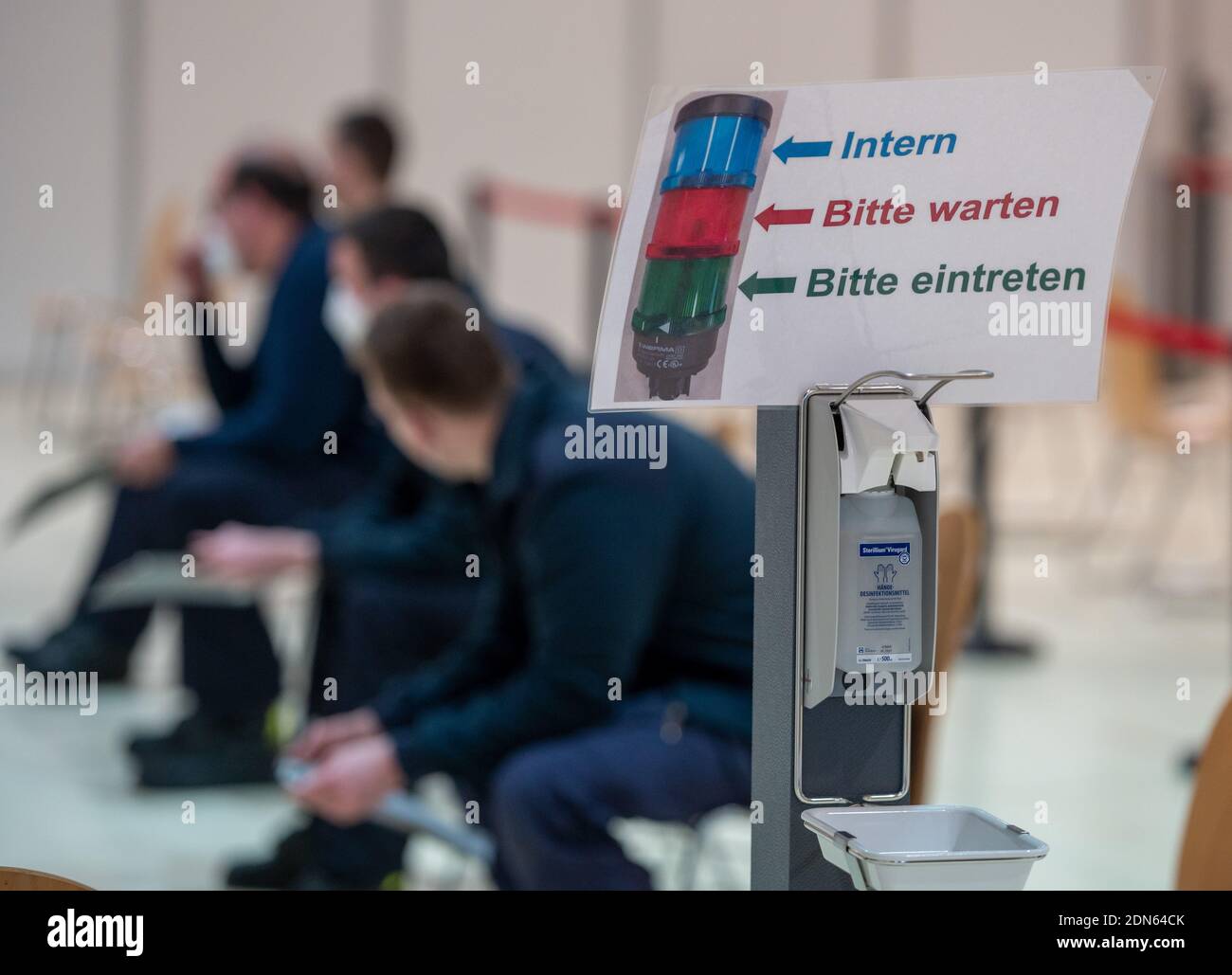 Trier, Germany. 17th Dec, 2020. Members of the Trier-Olewig volunteer fire brigade wait for the simulation of the vaccination during the test run under practical conditions. At the Trier Vaccination Centre, when vaccine is available, people from the city and surrounding district can be vaccinated against Corona. Credit: Harald Tittel/dpa/Alamy Live News Stock Photo