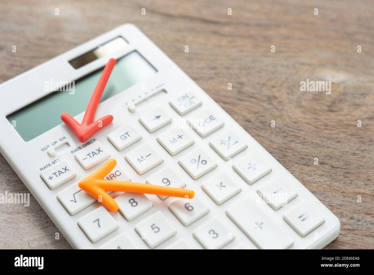 High Angle View Of Arrow Symbol Over Calculator On Table Stock Photo - Alamy