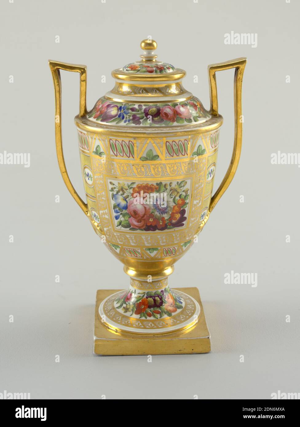 Urn with Gold and Flower Pattern, Royal Worcester, English, established 1751, porcelain, vitreous enamel, gold, Semi-ovoid, with domed top, raised strap handles and square base. Geometric design on body with square reserve on front, containing flowers. Floral bands about foot, foot bolted to body, top and cover. Gilding throughout., England, ca. 1795, ceramics, Decorative Arts, urn, urn Stock Photo