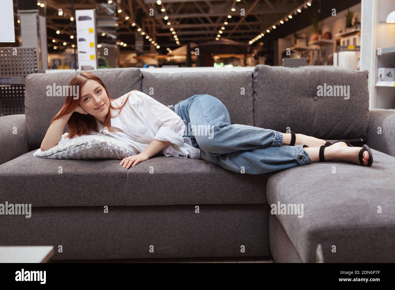 Woman sofa shop happy furniture hi-res stock photography and images - Alamy