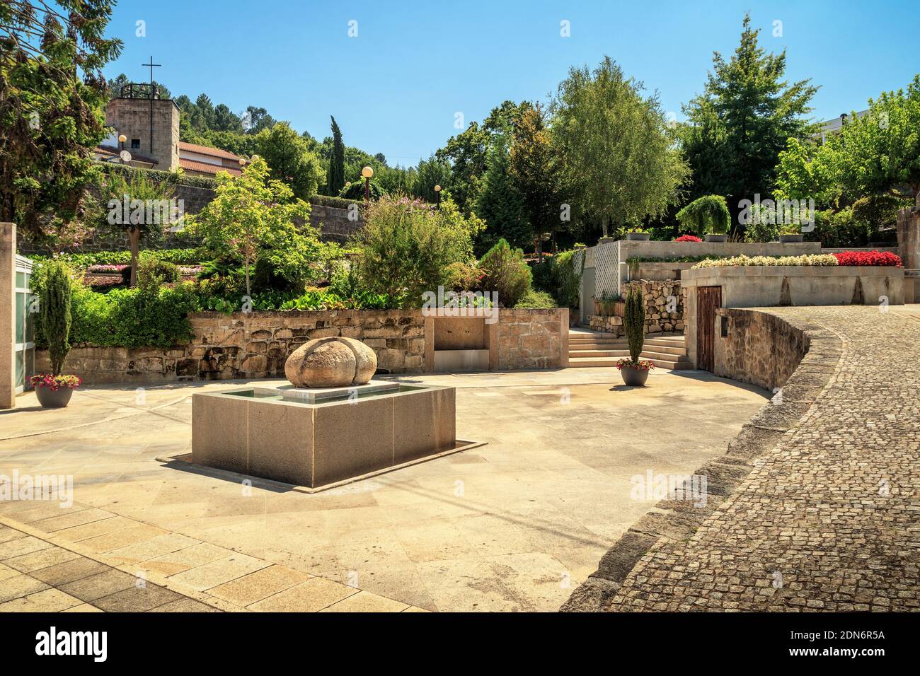 Thermal spring of the Termas de São Pedro do Sul in Portugal, with the Jardim das Termas in the background, on a summer afternoon. Stock Photo