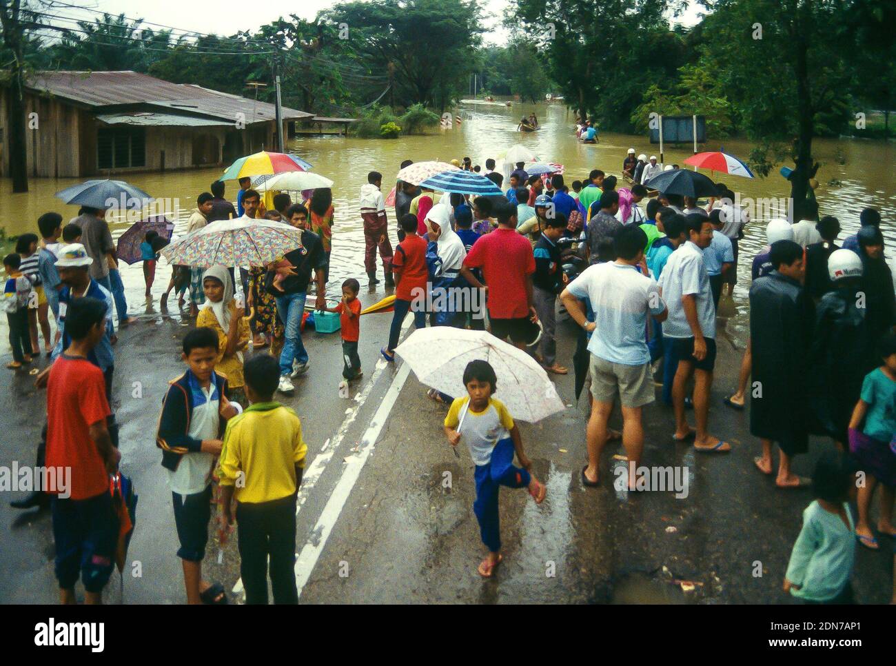 Floodwaters engulf road and rail links outside Gua Musang on the Jungle ...