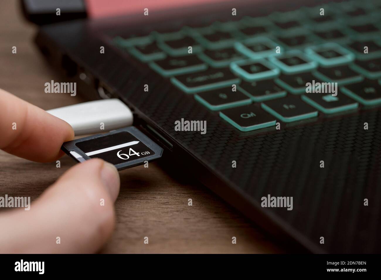Inserting sd memory card hires stock photography and images Alamy
