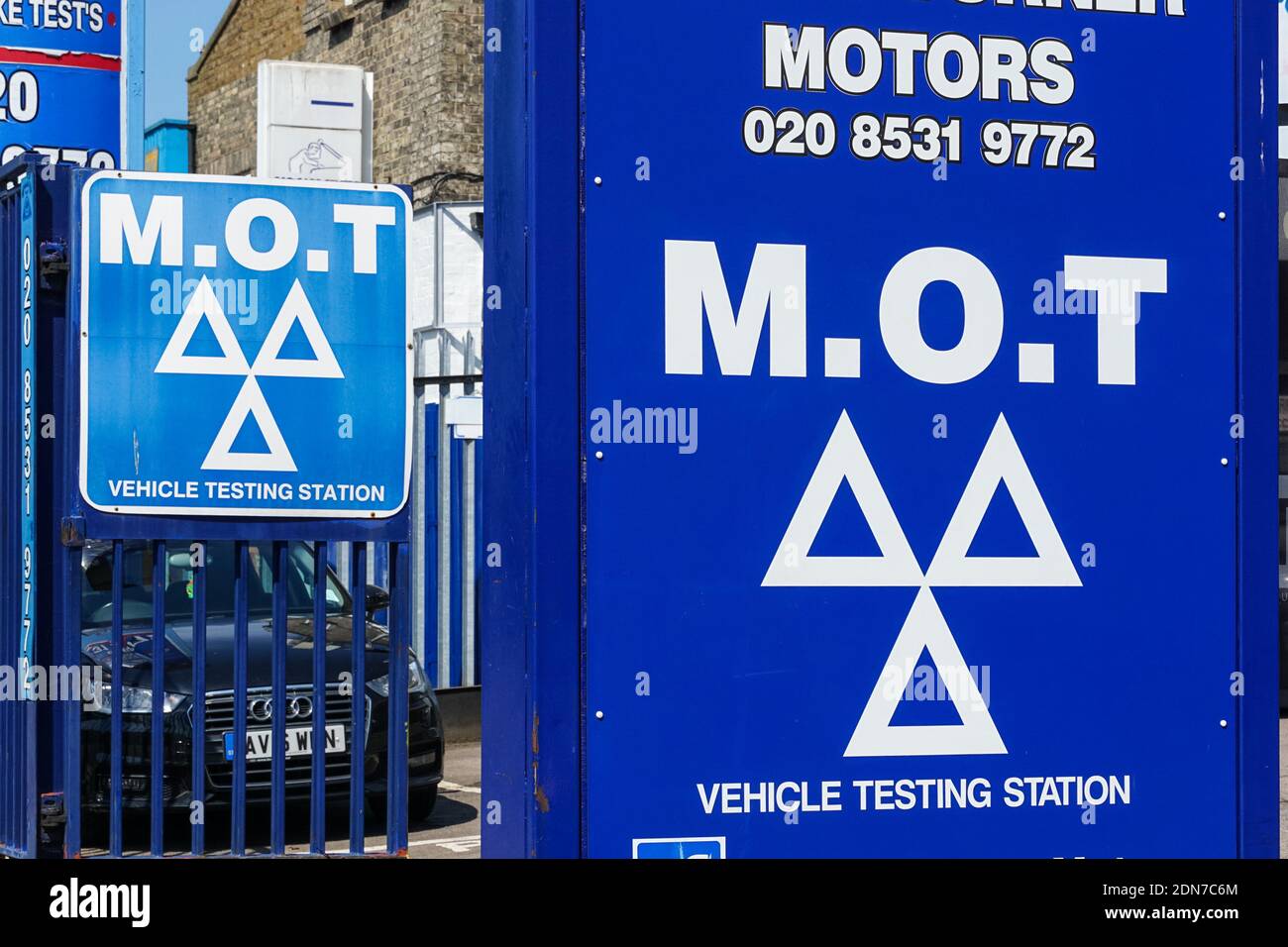 The blue three triangles logo at MOT test station in London England United Kingdom UK Stock Photo